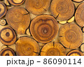 Wooden decorative panel made from round cuts of wood 86090114