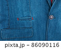 Denim blue formal suit with a pocket fragment for background. Elegant denim suit. Male jacket with pocket and buttons 86090116