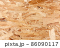 Wood texture. Osb wood board for background decoration. OSB board texture. Brown wooden background. 86090117