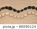 Curved line of white and black stones lying on the dunes. With space for design, text place 86090124