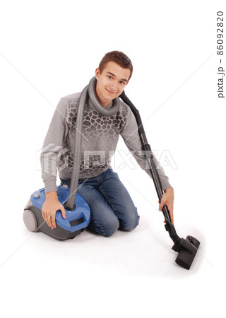 Boy with vacuum cleaner Boy with vacuum cleaner 86092820