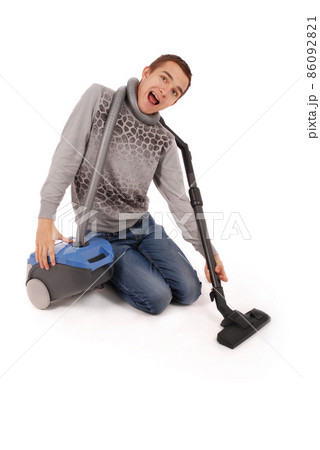 Boy with vacuum cleaner Boy with vacuum cleaner 86092821