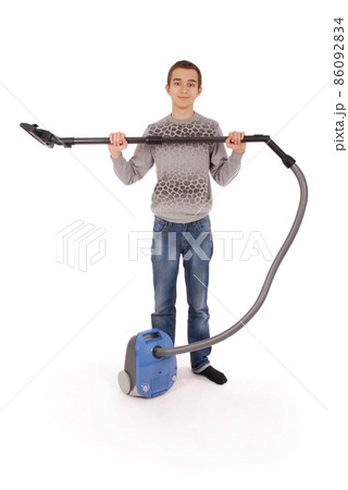 Boy with vacuum cleaner Boy with vacuum cleaner 86092834