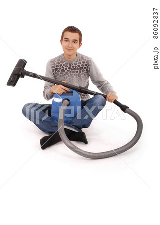 Boy with vacuum cleaner Boy with vacuum cleaner 86092837