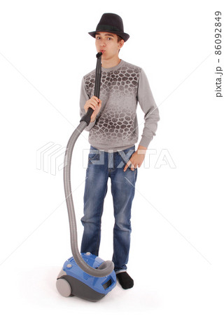 Boy in a hat holding a vacuum cleaner Boy in a hat holding a vacuum cleaner 86092849