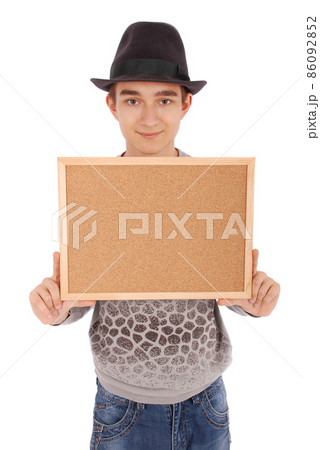 Boy in felt hat holds billboard 86092852