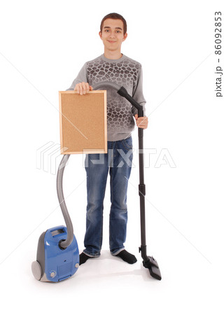 Boy holding a frame with a vacuum cleaner Boy holding a frame with a vacuum cleaner 86092853