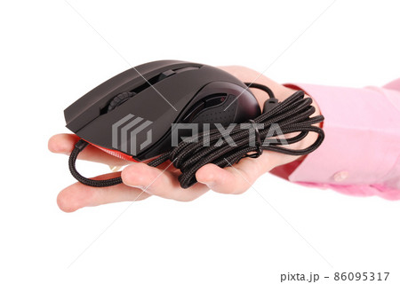 man holds in his hand black computer optical mouse man holds in his hand black computer optical mouse 86095317