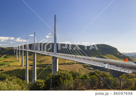 Multi-span cable stayed Millau Viaduct across gorge valley of Tarn River, Aveyron Departement, France 86097698