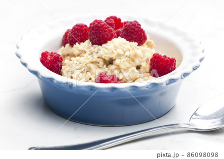 still life of porridge with raspberries 86098098