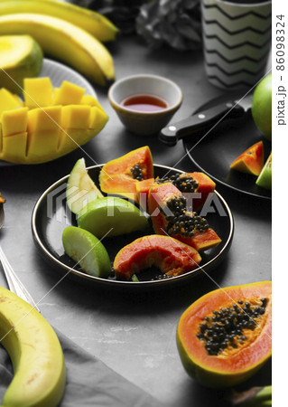 Summer food. Papaya, apple, banana healthy snacks. 86098324