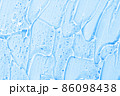 Cosmetic gel or beauty jelly serum texture background. Transparent skin care collagen product backdrop. Antibacterial sanitizer or liquid water moisture toner smudged smear close up photo 86098438