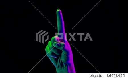 Female hand showing 1 with finger isolated on black background. One, two, three numbers gesture 86098496