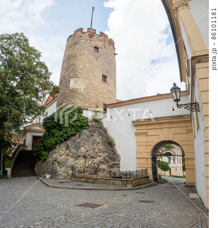 Old stony Mikulov castle tower against the blue sky. Old stony Mikulov castle tower against the blue sky. 86101181
