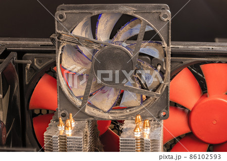 stopped 90 mm pc fan close-up with thick layer of dust stopped 90 mm pc fan close-up with thick layer of dust 86102593