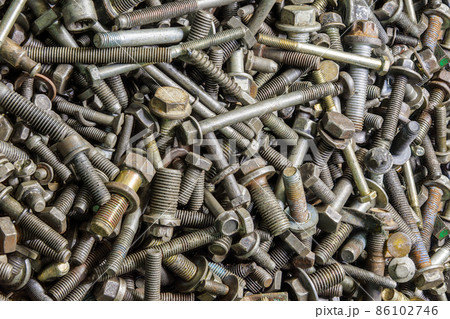 full frame background of used automobile bolts heap, old and dirty 86102746