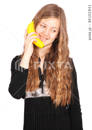 Girl holding fresh banana Girl holding fresh banana 86102841