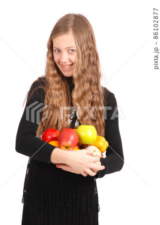 Girl holding fresh fruits Girl holding fresh fruits 86102877