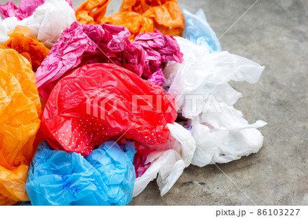 Colorful plastic bags on cement floor Colorful plastic bags on cement floor 86103227