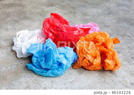 Colorful plastic bags on cement floor Colorful plastic bags on cement floor 86103228