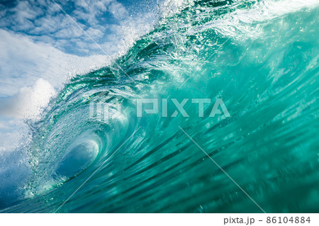 Wave with transparent water in Atlantic ocean. Glassy turquoise wave sunny day 86104884