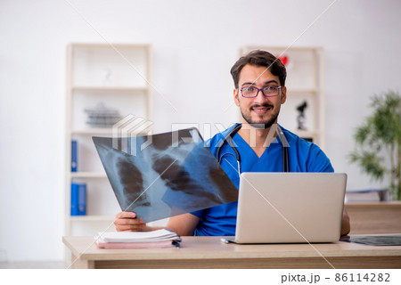 Young male doctor radiologist working in the clinic Young male doctor radiologist working in the clinic 86114282