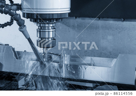 The CNC milling machine cutting the mold parts with oil coolant method. The CNC milling machine cutting the mold parts with oil coolant method. 86114556