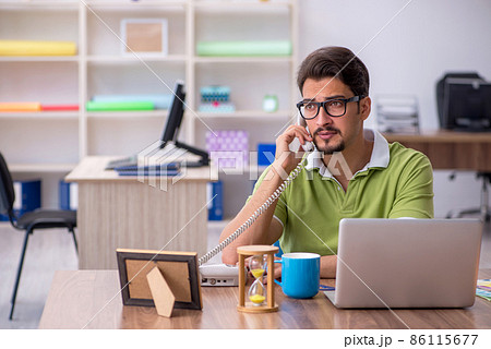 Young male designer working in the office 86115677