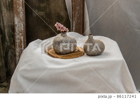Dried flowers in Handmade Double Ceramic Vases on table. Dried flowers in Handmade Double Ceramic Vases on table. 86117241