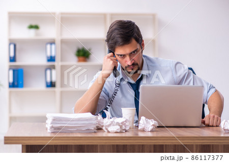 Young male employee rejecting new ideas in the office 86117377