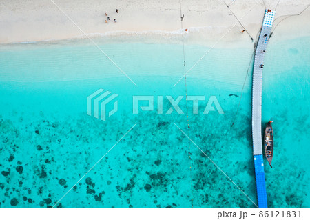 Coral island, koh He, beach and boats in Phuket province, Thailand Coral island, koh He, beach and boats in Phuket province, Thailand 86121831