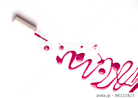 Blot of pink nail polish and brush isolated on white background with copy space for text. Manicure, pedicure, cosmetics concept. Blot of pink nail polish and brush isolated on white background with copy space for text. Manicure, pedicure, cosmetics concept. 86122823