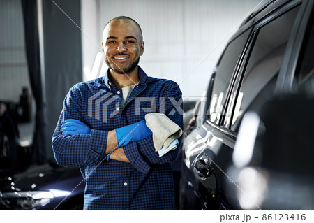 Portrait of African American man, car wash detailing service worker Portrait of African American man, car wash detailing service worker 86123416