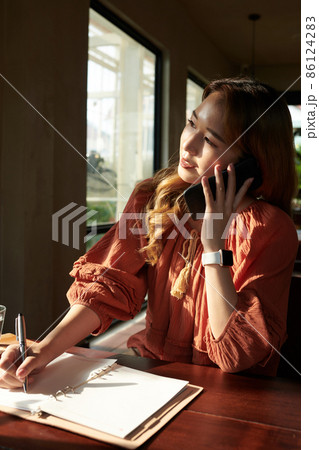 Businesswoman Talking on Phone 86124283