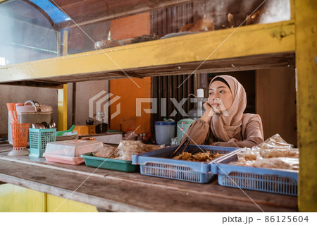 frustrated Young muslim entrepreneurs at her empty shop frustrated Young muslim entrepreneurs at her empty shop 86125604