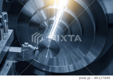The lathe machine finishing cut the brass shaft parts by lathe tools. 86127890
