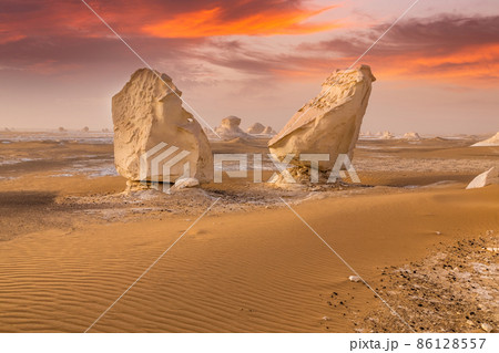Chalk rocks in the White Desert at sunset. Egypt, Baharia Chalk rocks in the White Desert at sunset. Egypt, Baharia 86128557