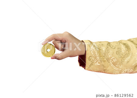 Hand holding golden Chinese coin Hand holding golden Chinese coin 86129562