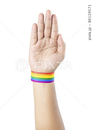 Human hand with LGBT rainbow flag wristband Human hand with LGBT rainbow flag wristband 86129571