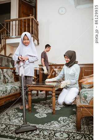girl in veil, brother and mother clean the house together girl in veil, brother and mother clean the house together 86129935