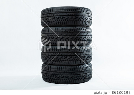 Stack of winter tires with specific structure and deep ridges shot in studio Stack of winter tires with specific structure and deep ridges shot in studio 86130192