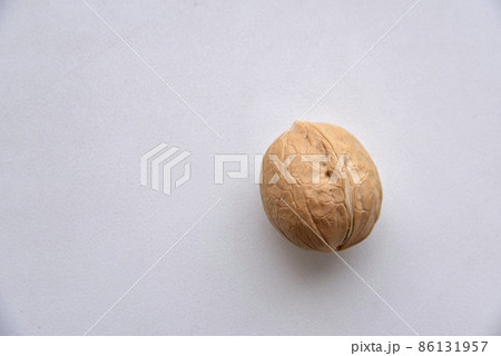 Walnuts in a shell on a white background 86131957