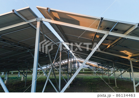 Ground based steel frame of large sustainable electrical power plant with rows of solar photovoltaic panels for producing clean ecological electric energy 86134463