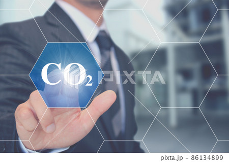 CO2二酸化炭素のボタンを押すビジネスマン Businessman touching Co2  86134899