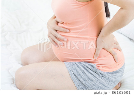Feeling bad concept - Close up of pregnant woman suffering stomachache. Concept of pregnancy, maternity, health care, gynecology, medicine.Constipation and belly cramps. Feeling bad concept - Close up of pregnant woman suffering stomachache. Concept of pregnancy, maternity, health care, gynecology, medicine.Constipation and belly cramps. 86135601