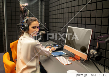 Professional working on the mixing console in the studio Professional working on the mixing console in the studio 86138019