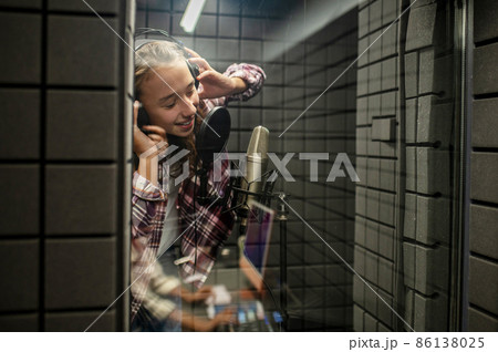Singer enjoying the process of recording a song Singer enjoying the process of recording a song 86138025