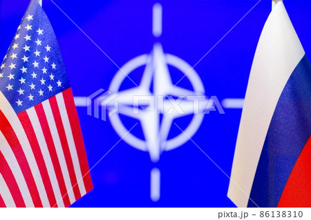 The US flag, the Russian flag and NATO flag with copy space for text. Flag of USA, flag of Russia. The United States of America and the Russian Federation confrontation. Russia's invasion of Ukraine 86138310
