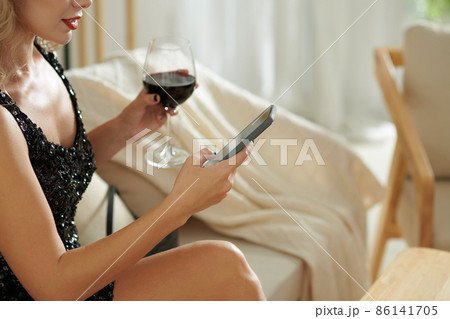 Woman Drinking and Texting 86141705