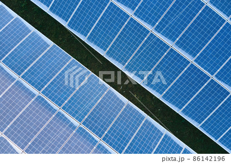 Aerial view building roof with rows of blue solar photovoltaic panels for producing clean ecological electric energy. Renewable electricity with zero emission concept 86142196